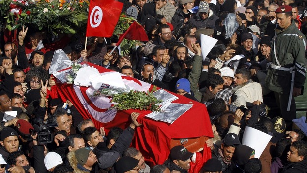 Mourners carry the coffin of slain opposition leader Chokri Belaid