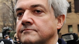 Chris Huhne leaving court