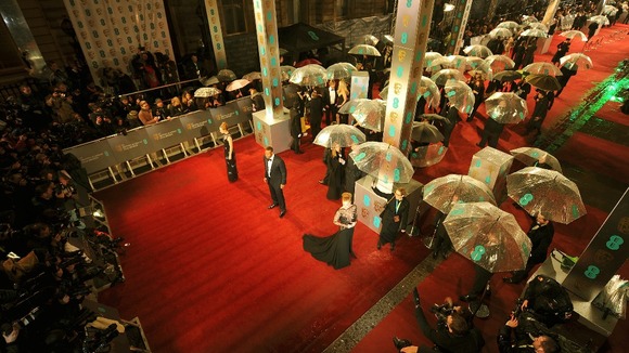 The red carpet outside the Royal Opera House in central London was awash with unbrellas