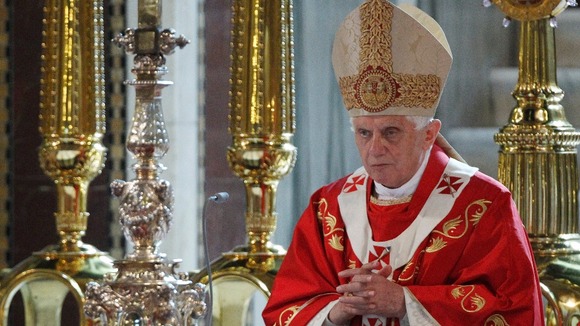 Pope Benedict XVI prays during a mass in London in 2010