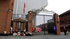 Tributes outside the gates next to the Hillsborough Memorial at Anfield.