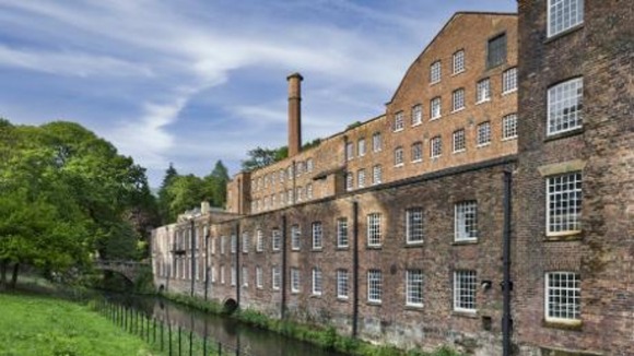 The dramatic backdrop of Quarry Bank Mill from the Mill meadow.