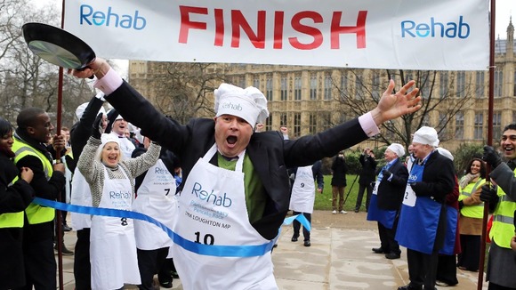 Conservative MP Tim Loughton crosses the finishing line victorious.