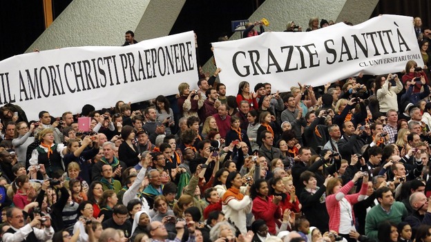 A sign in Italian saying 'Thanks Holiness' is seen as Pope Benedict XVI begins his general audience