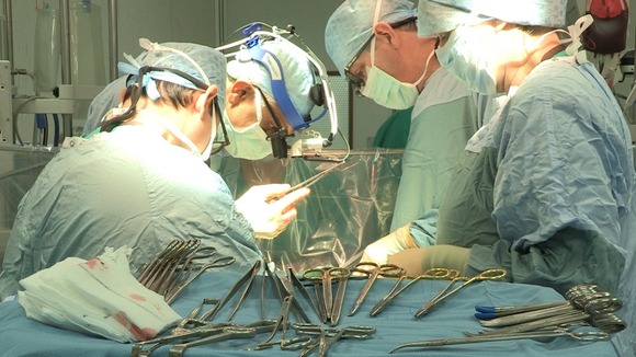 Surgeons performing an operation