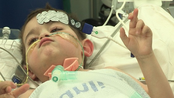 Close up of young boy on hospital bed ready for operation