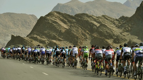 Cyclists compete in the 118-mile third stage of the Tour of Oman cycling race