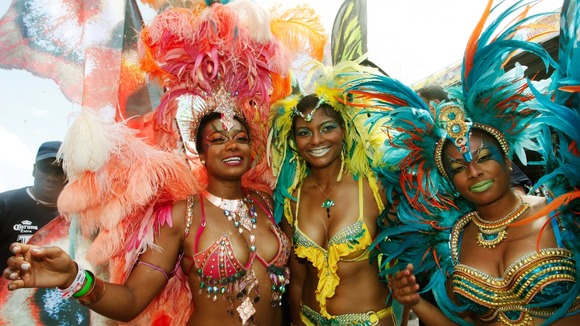 American actress Tatyana Ali (L) with her sisters on the final day of the Trinidad and Tobago Carnival