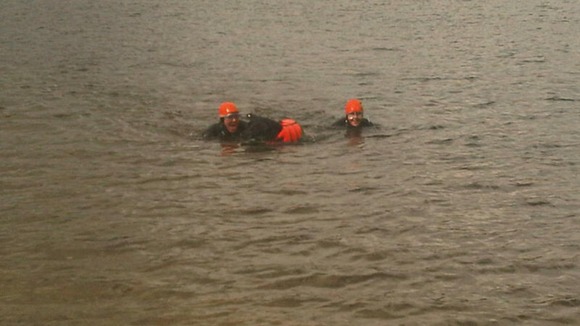 Taking a dip with his owners