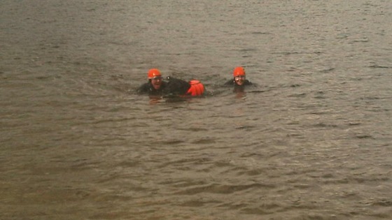Taking a dip with his owners