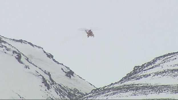 One of the RAF helicopters hovers over the Chalamain Gap area of the Cairngorms.
