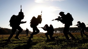 Soldiers from The Territorial Army London Regiment during a compound clearance exercise at Wretham Camp training area in Thetford, Norfolk.