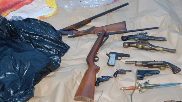 The selection of guns included a loaded shotgun and air rifles