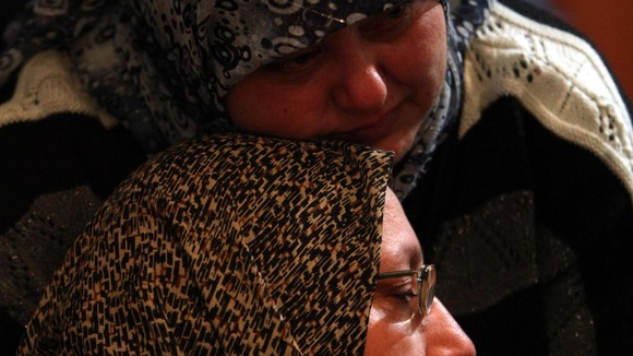woman mourns for her son Ali Shaaban, a television cameraman who was shot dead on the Lebanon-Syria border.