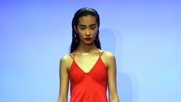 A model walks the catwalk at London Fashion Week.