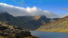 Cloud billows over mountains