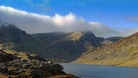 Cloud billows over mountains