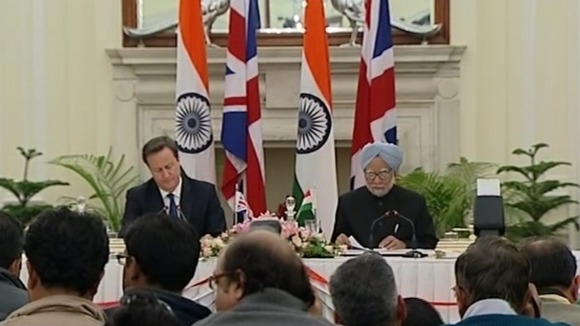 David Cameron and Prime Minister Manmohan Singh give a press conference