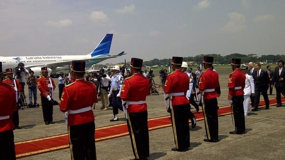 The Prime Minister is welcomed at the airport in Jakarta.
