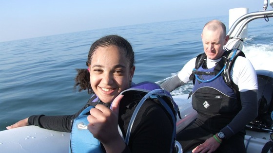 Maia Wallace-Loizou gives the thumbs up after arriving successfully 