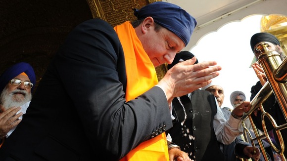 David Cameron is shown around the Golden Temple
