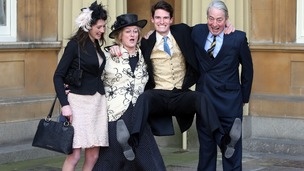 Jumping for joy: Olympic Gold Medalist Peter Wilson with his parents and girlfriend at Buckingham Palace