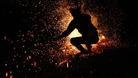  Vietnamese man from the Pa Then minority group jumps into a fire