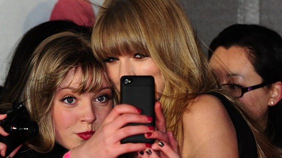 Taylor Swift poses for photographs