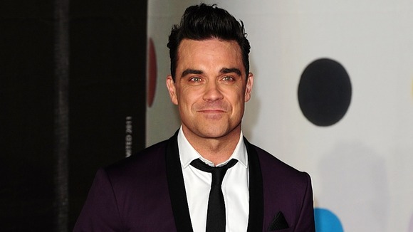 Robbie Williams arriving for the 2013 Brit Awards 