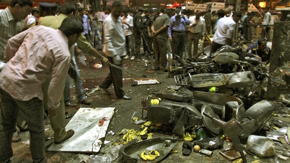 Police examine the site of an explosion in the southern Indian city of Hyderabad