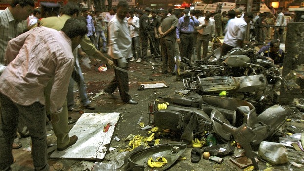 Police examine the site of an explosion in the southern Indian city of Hyderabad