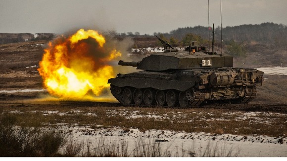 A British tank fires during training in Germany