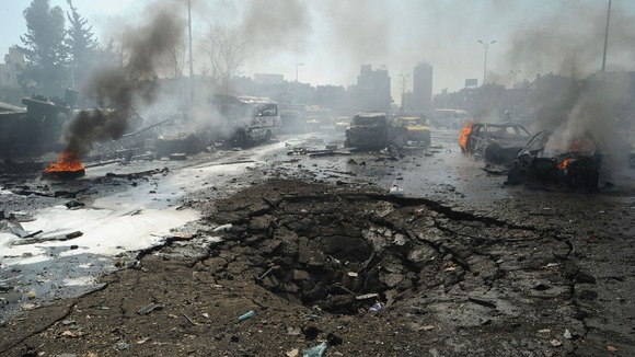 A large crater can be seen after a massive blast in Damascus