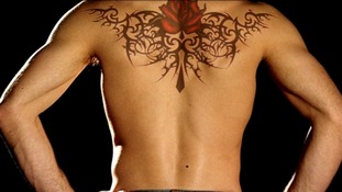 Tattoo across a man's back
