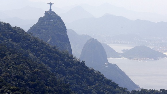 Dwarfed by the mountains the Christ the Redeemer statue