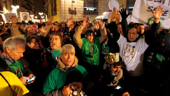 Supporters of the "Marea Ciudadana" platform take part in a demonstration against cuts, calling for a resignation of the Spanish government.