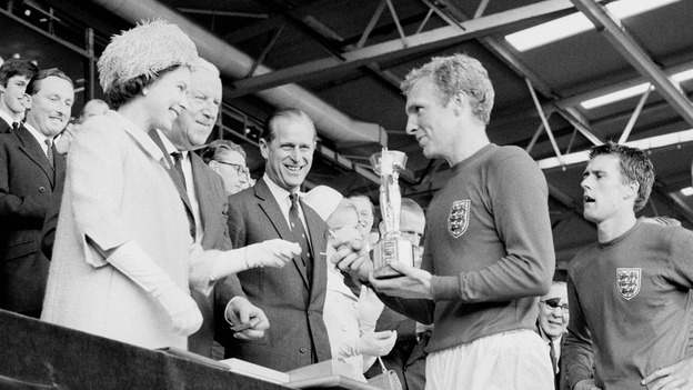 Bobby Moore collects the Jules Rimet Trophy from the Queen after England's 1966 victory