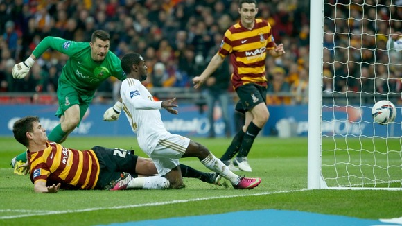Swansea City's Nathan Dyer (C) shoots to score during their English League Cup final soccer match against Bradford City at Wembley Stadium