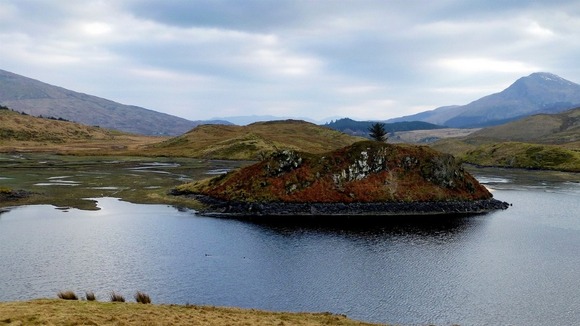 Mountains and lakes under cloudy skies