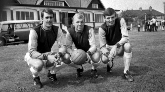 Geoff Hurst, Bobby Moore, and Martin Peters take a break from training at West Ham's press day at Chadwell Heath, 16th August 1966.