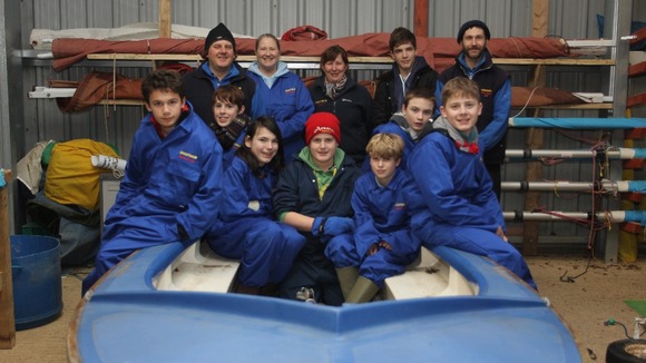 Pupils, staff staff prepare their new dinghy