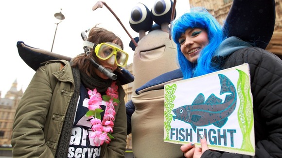 Campaigners get into the spirit in fish and diving costumes outside Westminster.