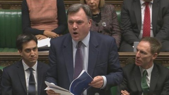 Ed Balls refers to a copy of the Tory manifesto as he attacks George Osborne's economic record.
