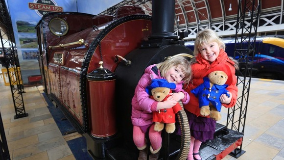 Three-year-old Alexandra Brimmer (left) and five-year-old Imogen Brimmer pose on the Princess, the world's first narrow gauge steam engine.