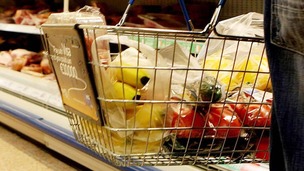 File photo of a shopper holding a shopping basket in a supermarket.
