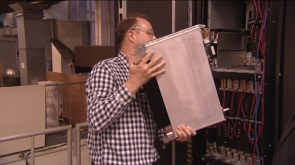 A Leeds University lecturer demonstrates the new liquid-based cooling system