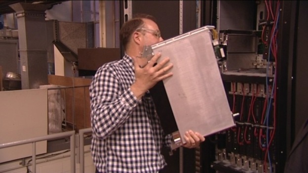 A Leeds University lecturer demonstrates the new liquid-based cooling system