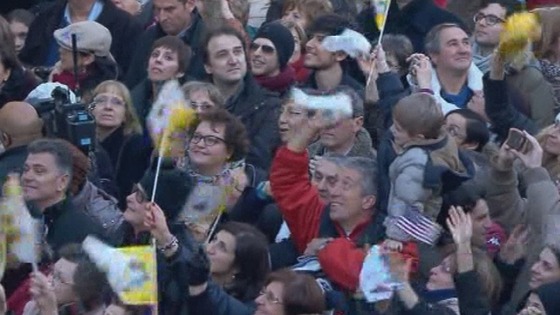 The crowds wave flags and cheer as Pope Benedict XVI arrives at Castel Gandolfo.