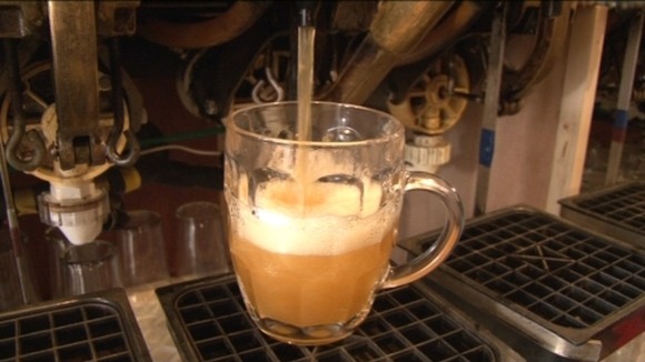 pint of cider being poured