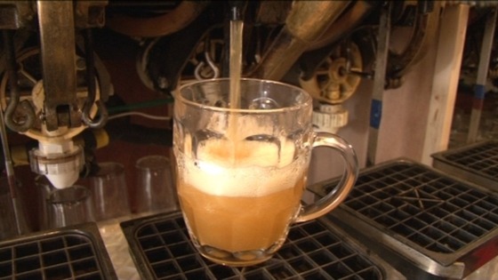 pint of cider being poured